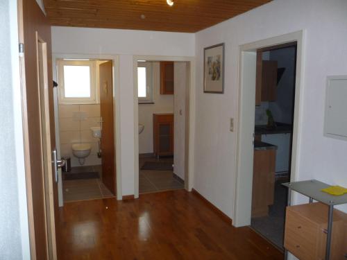 a hallway of a house with a bathroom at Ferienwohnung Emily in Friesenheim