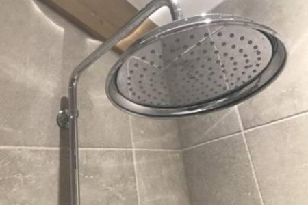 a strainer in a shower in a bathroom at SKITTLES - charming one bedroom apartment - parking - easy access to Bath in Box