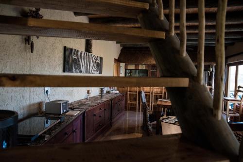 Kuchyň nebo kuchyňský kout v ubytování Hartenbos Private Game Lodge