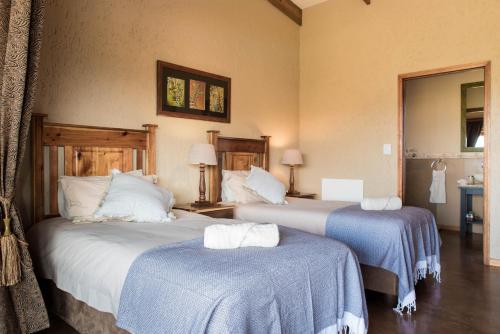 Postel nebo postele na pokoji v ubytování Hartenbos Private Game Lodge