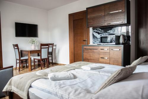 Postel nebo postele na pokoji v ubytování Willa Kasztan