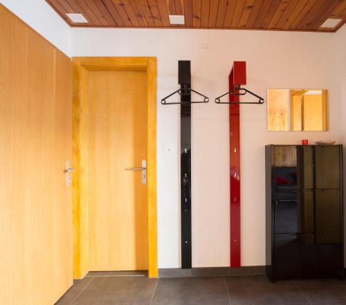 a room with a door and a cross on the wall at Immeuble Horizon in Les Collons