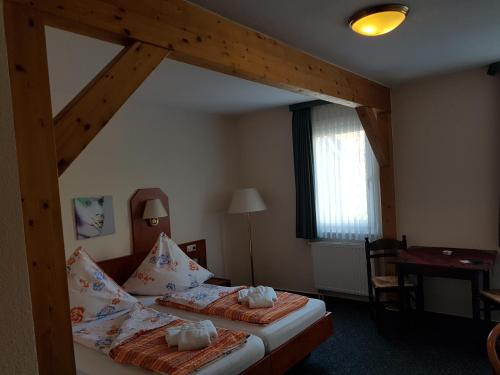 a bedroom with two beds in a room at Desperados Hotel in Bergen