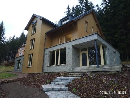 a house that is sitting on top at Penzion Eden in Pec pod Sněžkou