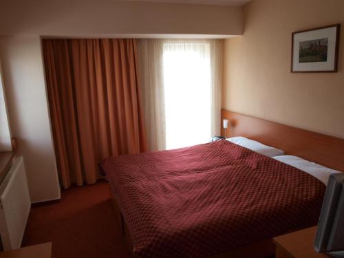 Posteľ alebo postele v izbe v ubytovaní Hotel Dominika