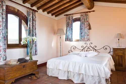 Ein Bett oder Betten in einem Zimmer der Unterkunft Poderi Arcangelo