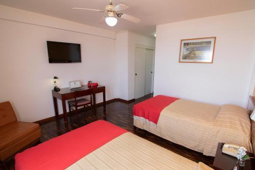 Postel nebo postele na pokoji v ubytování Hotel Chavín