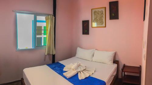 מיטה או מיטות בחדר ב-Sangchan hostel