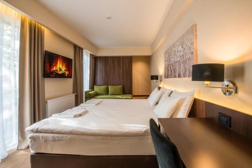 Postel nebo postele na pokoji v ubytování Hotel Spa Grad