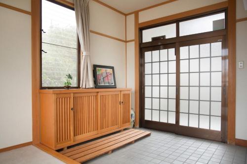 an entrance to a room with a glass door at 日照庵 Nisshouan in Kyoto
