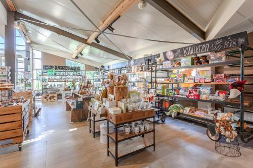 a store with a lot of shelves of products at Hajé Hotel Restaurant de Lepelaar in Lelystad