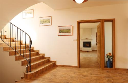 a staircase in a home with a stair case at U Floderů in Bavory