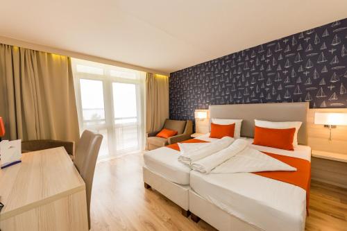Ένα ή περισσότερα κρεβάτια σε δωμάτιο στο Hotel Móló