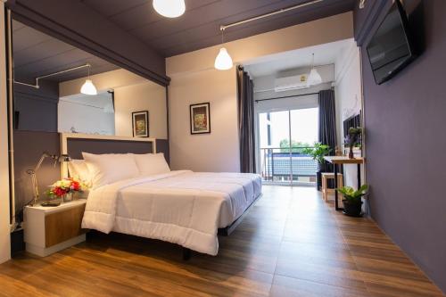 Ένα ή περισσότερα κρεβάτια σε δωμάτιο στο Mango 10 House