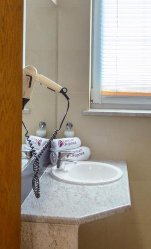 a bathroom sink with a faucet on a counter at Centrum Okopowa 55 in Warsaw