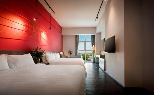 Cama ou camas em um quarto em KIP Hotel