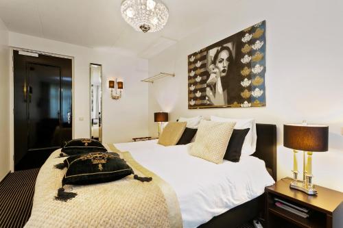 Кровать или кровати в номере Hotel Garni Villa Arrisja