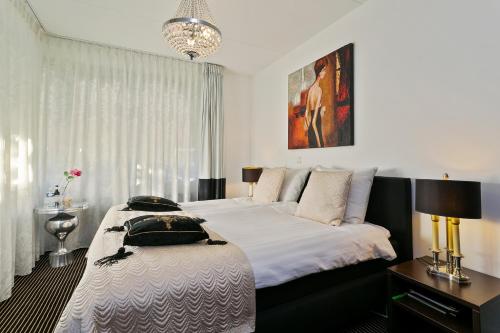 Кровать или кровати в номере Hotel Garni Villa Arrisja