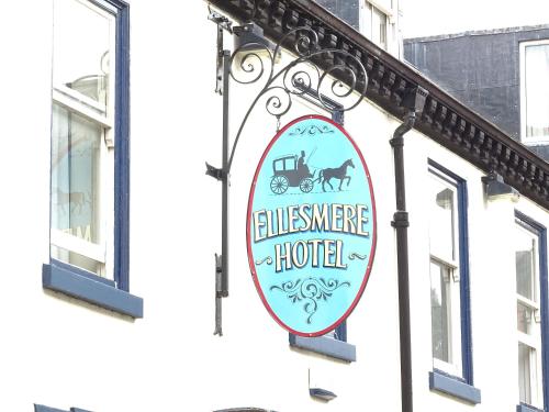 a sign for a hotel on the side of a building at Ellesmere Hotel in Ellesmere