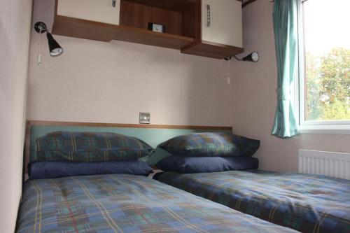 מיטה או מיטות בחדר ב-Loch View