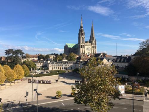a view of a city with a cathedral at Le Boeuf Couronné - Hôtel & Restaurant Chartres- Logis Hotels in Chartres