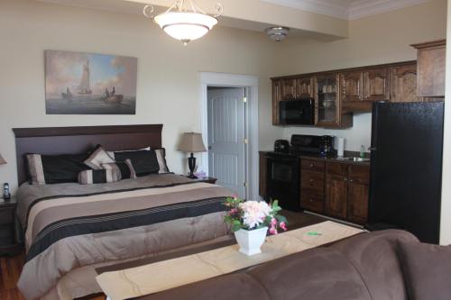 Ένα ή περισσότερα κρεβάτια σε δωμάτιο στο Revere Suites