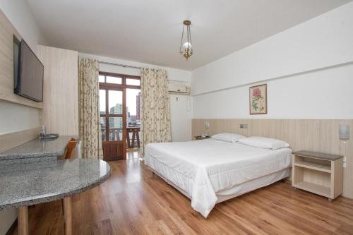 Katil atau katil-katil dalam bilik di Alven Hotel by Slaviero Hotéis