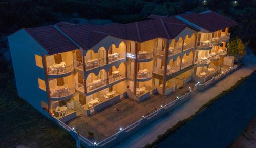 an overhead view of a building with lights on at House Meltemi in Kalamitsi
