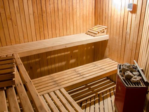 a wooden sauna with a wooden bench in it at Terrado Suites Iquique in Iquique