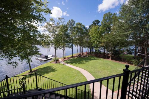 a house with a boat on the water at The Pointe in Greensboro