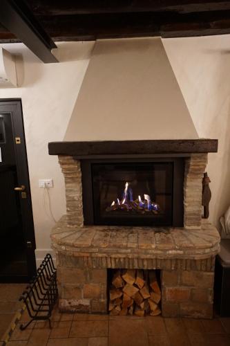 a fireplace with a fire in it at P 1779 in Venice
