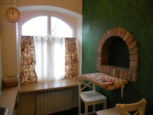 a room with a window and a table and a window at Apartament Katowice - Nikiszowiec in Katowice