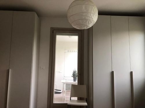 a room with a light hanging from a ceiling at La stanza di Cesare in Treviso