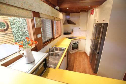 a small kitchen with a sink and a counter at Silverpoint Estate in Pokolbin