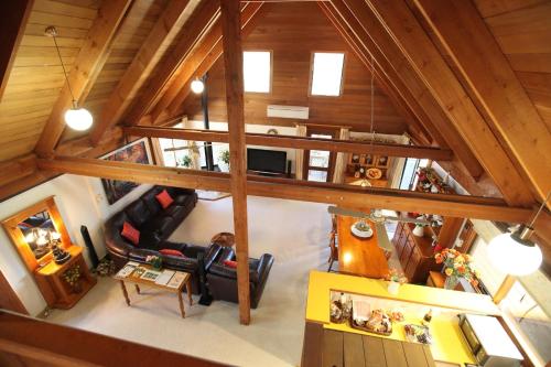 an overhead view of a living room and kitchen with wood ceilings at Silverpoint Estate in Pokolbin