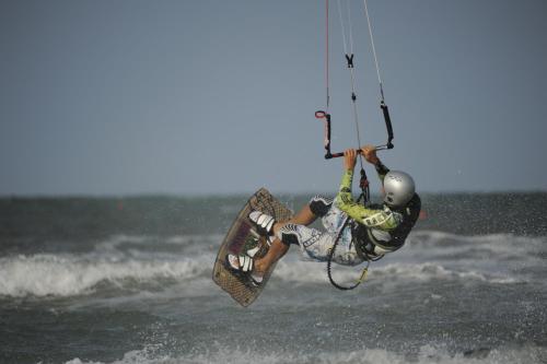 a man flying through the air on a wake board at Hotel San Francisco Spiaggia in Rimini