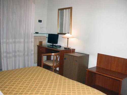 Postel nebo postele na pokoji v ubytování Hotel Calabresi