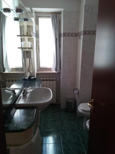 a bathroom with a sink and a toilet at Balletti Park Hotel in Viterbo