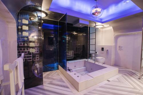 a bathroom with a large tub in a room at Motel Stars in Taichung