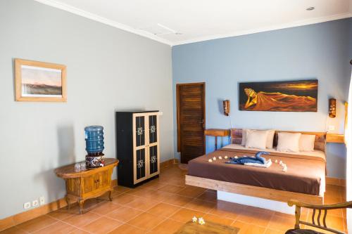 Katil atau katil-katil dalam bilik di Mandalika Cottage