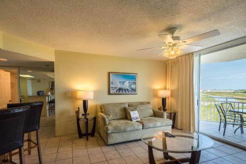 a living room with a couch and a glass table at Sunrise Suites Panama Suite #310 in Key West