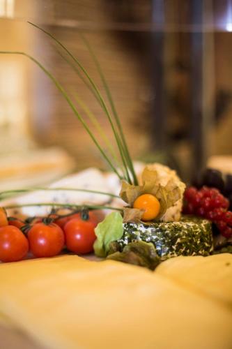 a bunch of fruits and vegetables on a table at Meiser Design Hotel in Dinkelsbühl