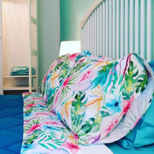 a pillow sitting on top of a bed at Il Gatto Sulla Finestra in Iesi