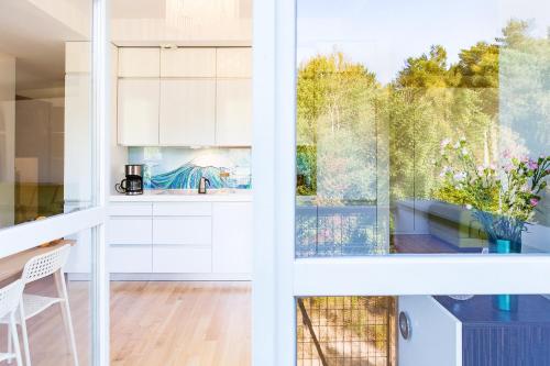 Kuchyň nebo kuchyňský kout v ubytování Apartamenty Bałtycka by Noclegi Renters