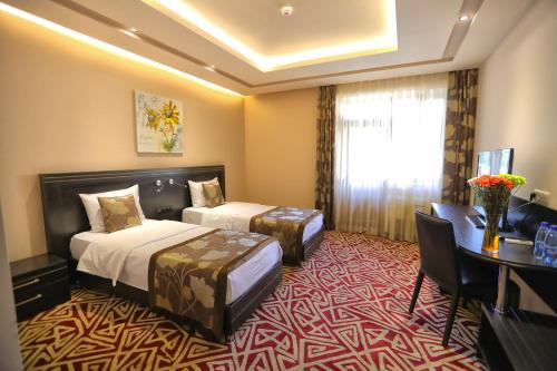 Postel nebo postele na pokoji v ubytování Aghveran Ararat Resort Hotel
