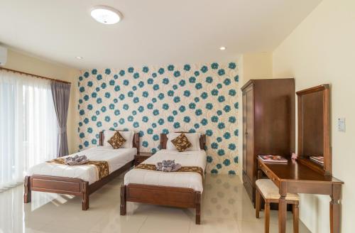Ένα ή περισσότερα κρεβάτια σε δωμάτιο στο Alisa Krabi Hotel-SHA Plus