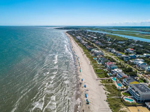 an aerial view of a beach with houses and the water at The Palms Oceanfront Hotel in Isle of Palms
