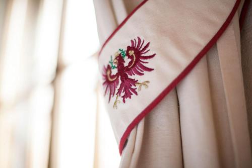 a close up of a flag with a dragon on it at Alpenrast Tyrol in Mils bei Imst