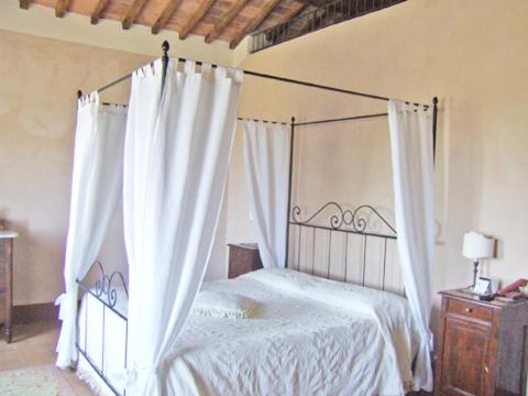 Ένα ή περισσότερα κρεβάτια σε δωμάτιο στο Villa Cicolina