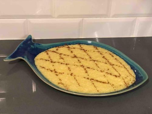 a pie in a blue dish on a table at SEA RIA - A casa dos Maria in Costa Nova